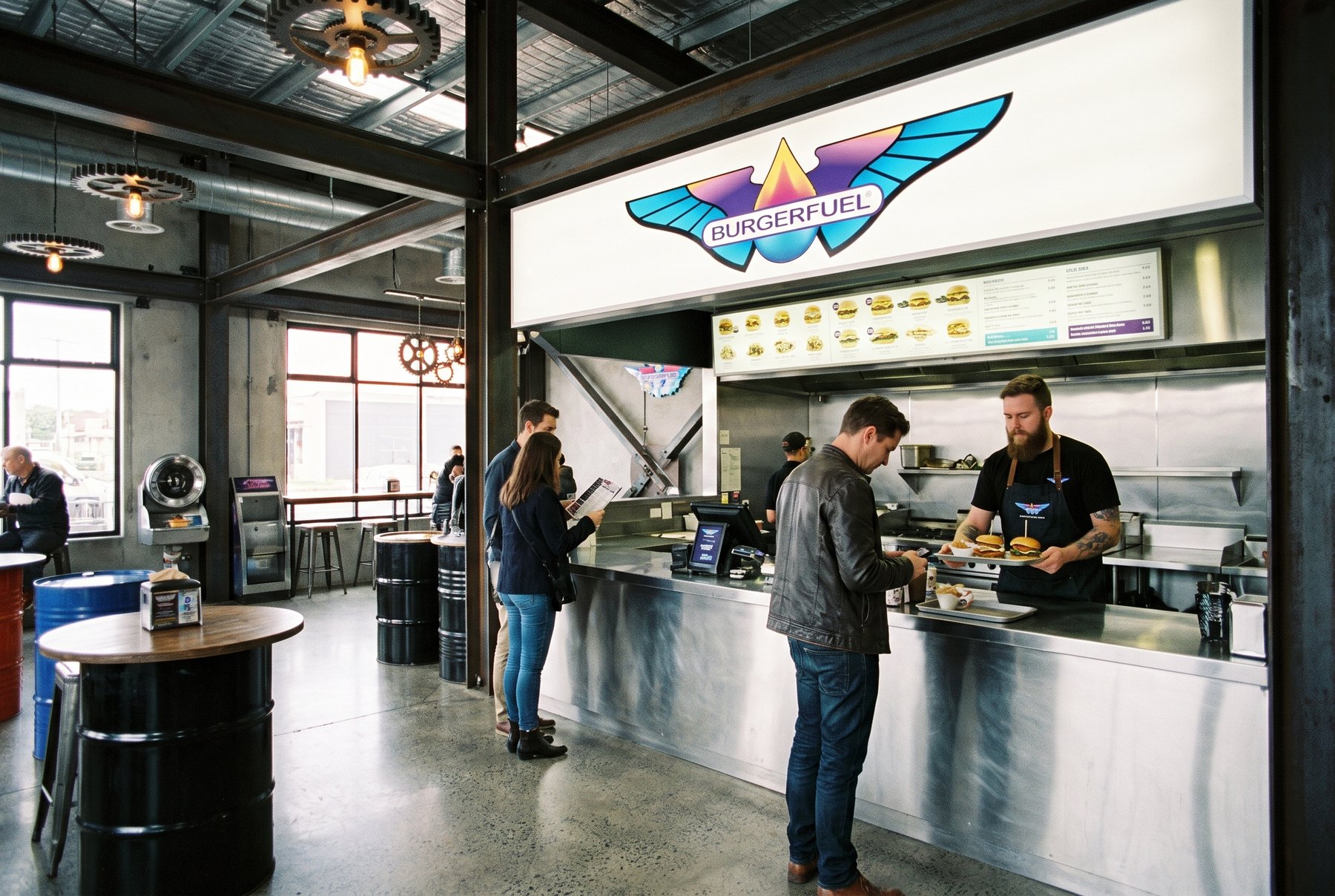 The BurgerFuel in-store environment, menu boards lit above the counter