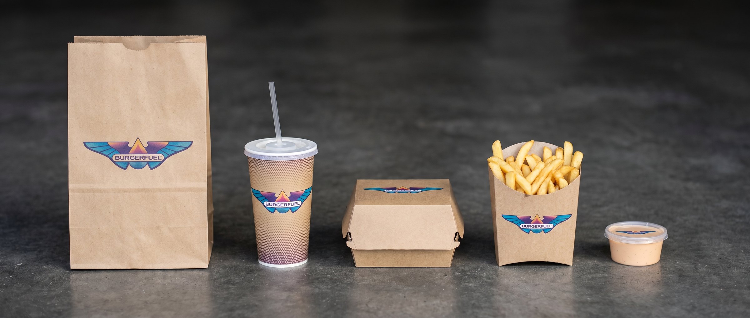 The BurgerFuel takeaway packaging family: bag, cup, burger box, fries carton and sauce tub