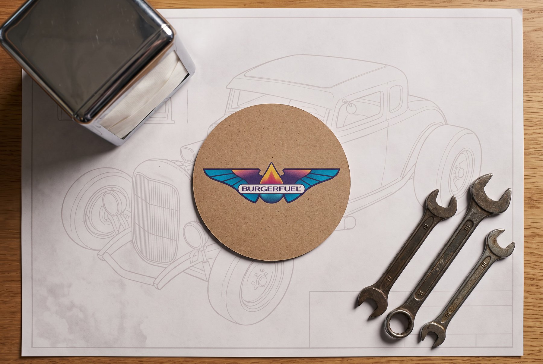 Printed table mat with hot-rod blueprint pattern and a branded coaster
