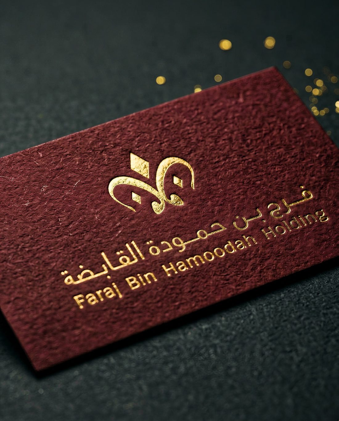 Maroon business cards with gold foil bilingual signature