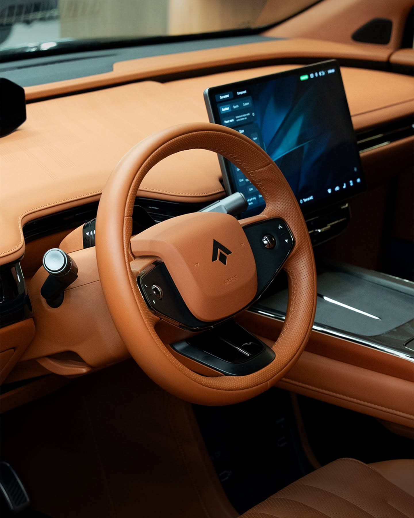 The tan leather cabin and driver display of the HYPTEC HT