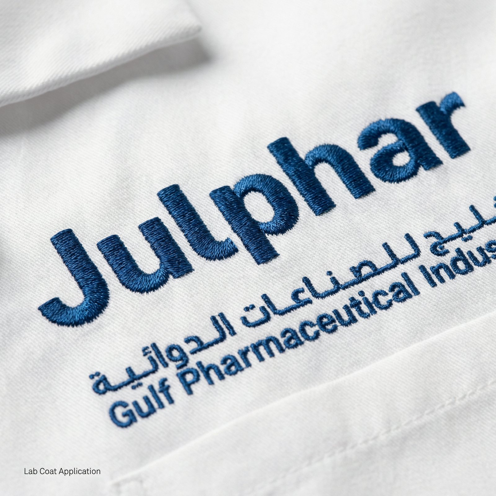 The Julphar wordmark embroidered on a lab coat