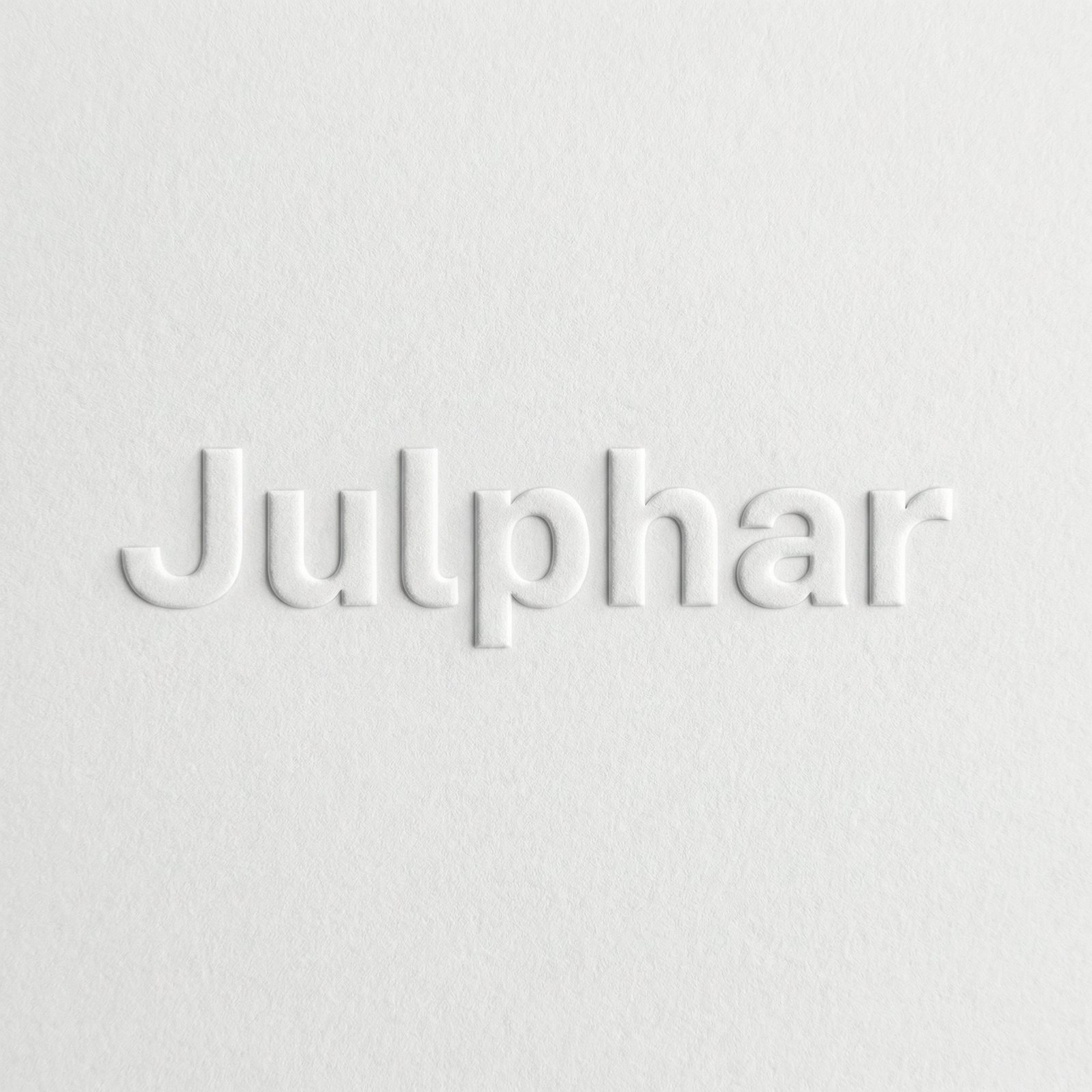 The Julphar wordmark blind-embossed into white paper
