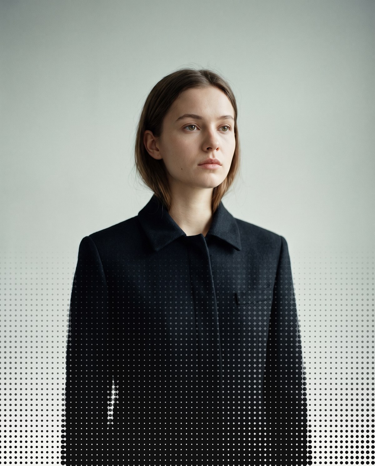 A fashion portrait breaking down into halftone dots from the chest down